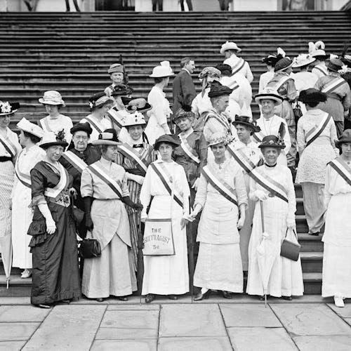 An old black-white photo with suffragettes posing together