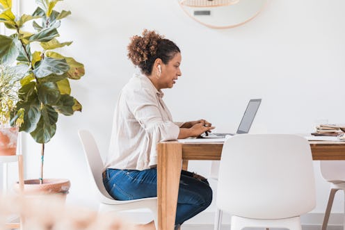 A therapist on a video call with a client. Therapists are under the same pandemic stress their clien...