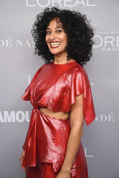 Tracee Ellis Ross looks stunning in her naturally curly curtain bangs. 