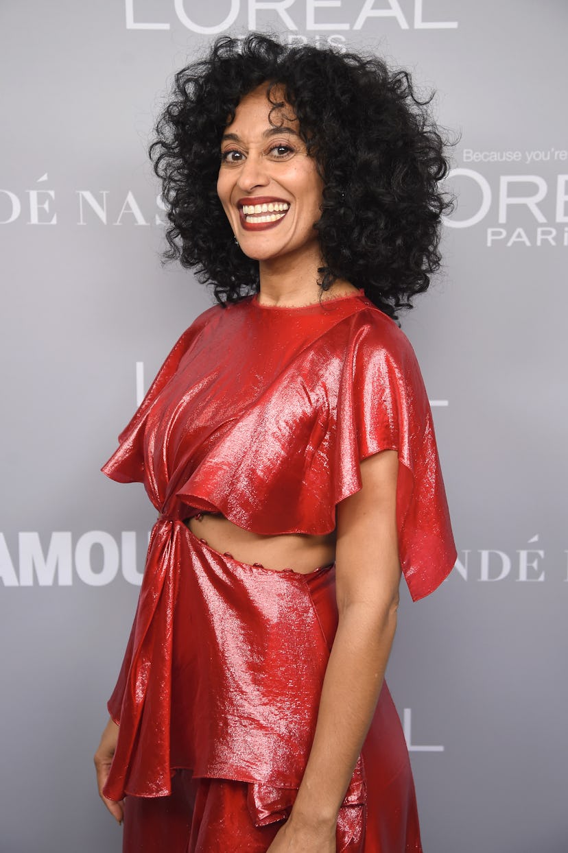 Tracee Ellis Ross looks stunning in her naturally curly curtain bangs. 