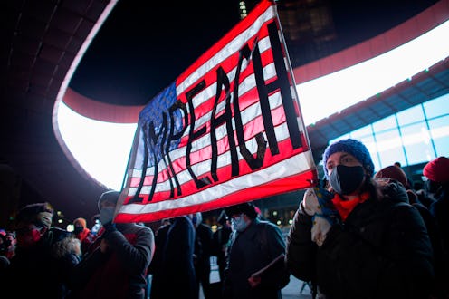 An American flag with the word "impeach"