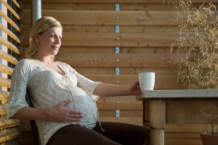 pregnant woman sitting at table