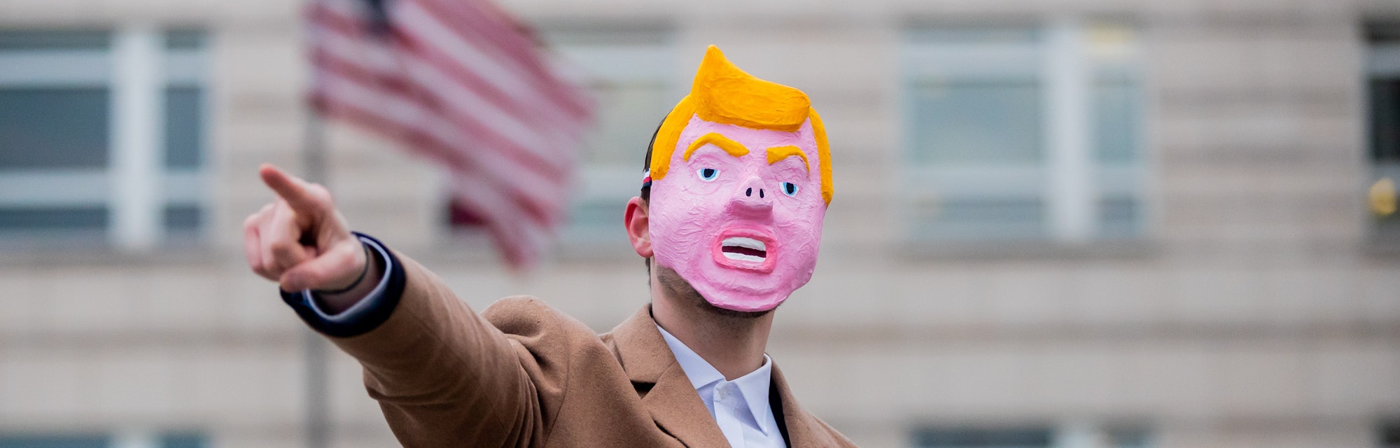 A man in a Trump mask.