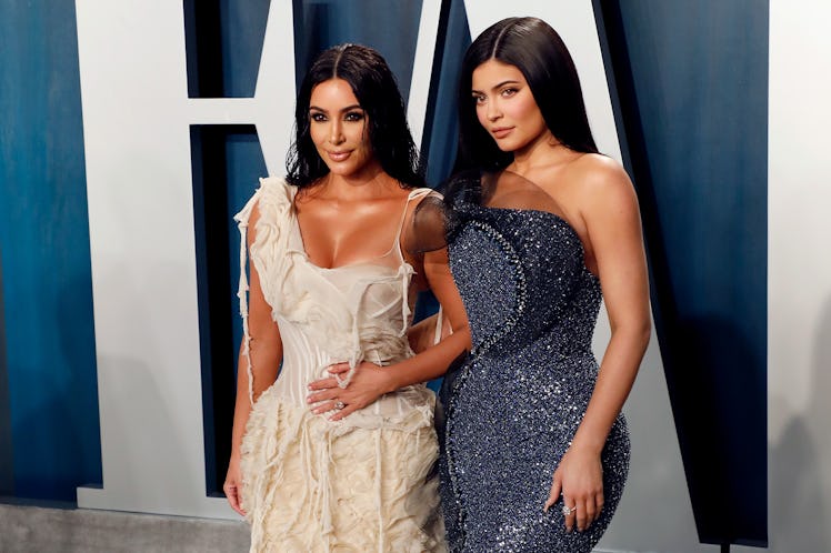 Kim Kardashian and Kylie Jenner stand together on the red carpet at an event in gorgeous gowns. 