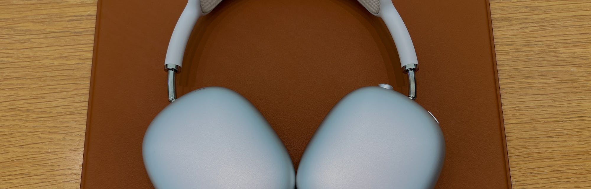 Apple AirPods Max pictured resting on a table.