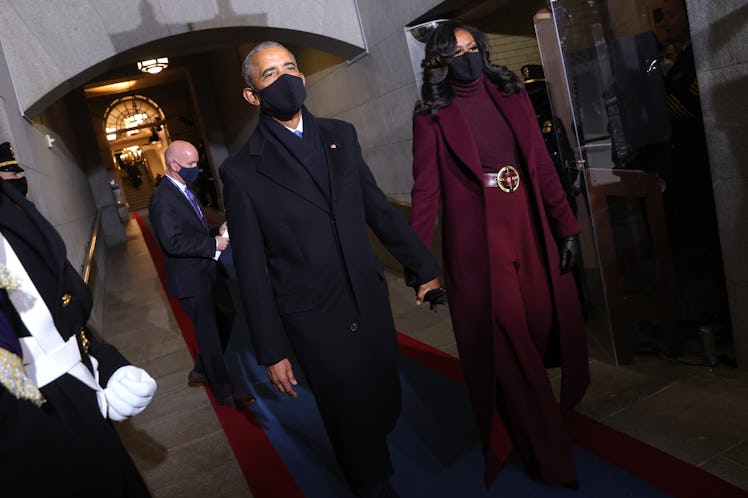 Barack Obama and Michelle Obama arriving at Captol while holding hands.