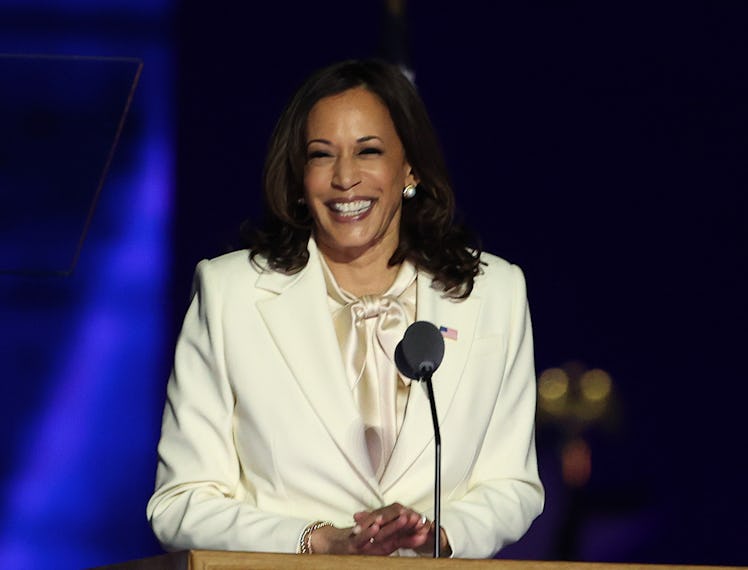Kamala Harris steps up to the podium to make a speech.