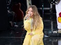 Sabrina Carpenter performs in a light yellow outfit.