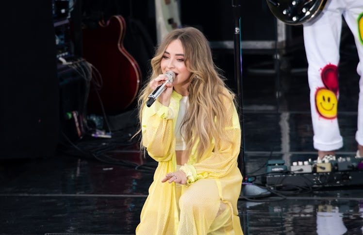 Sabrina Carpenter performs in a light yellow outfit.