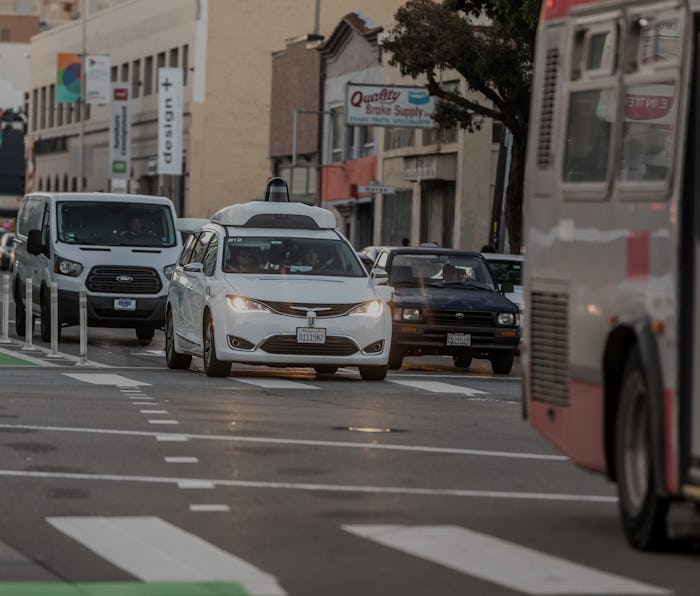 Waymo's autonomous van driving on a street in San Francisco.