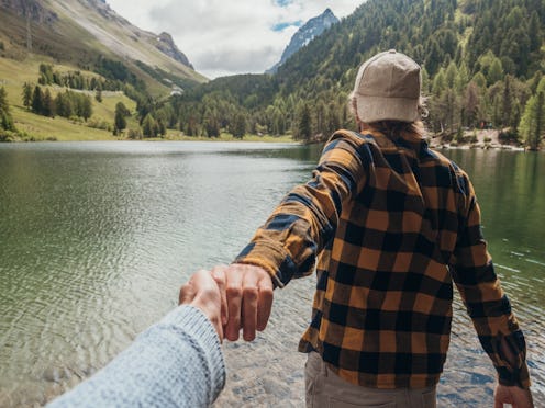 A man and a woman on a hike. 