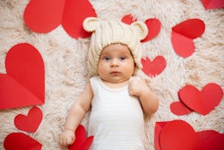 baby surrounded by hearts, what does it mean when your born on valentine's day
