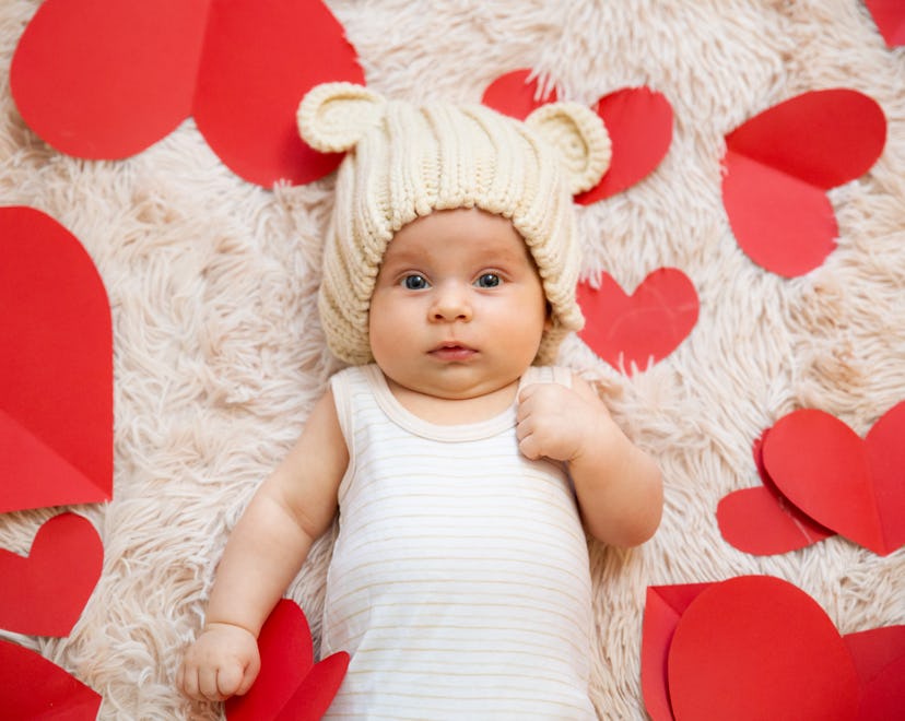 baby surrounded by hearts, what does it mean when your born on valentine's day