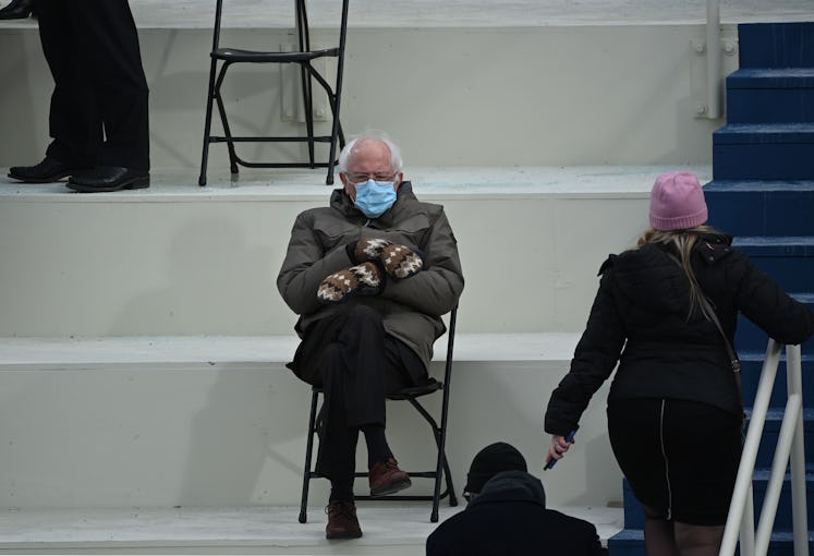 The image of Bernie Sanders wearing his trademark mittens and a blue surgical mask during President ...