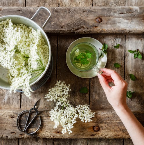 A person makes an elaborate tea as an alternative to alcohol after finishing Dry January.