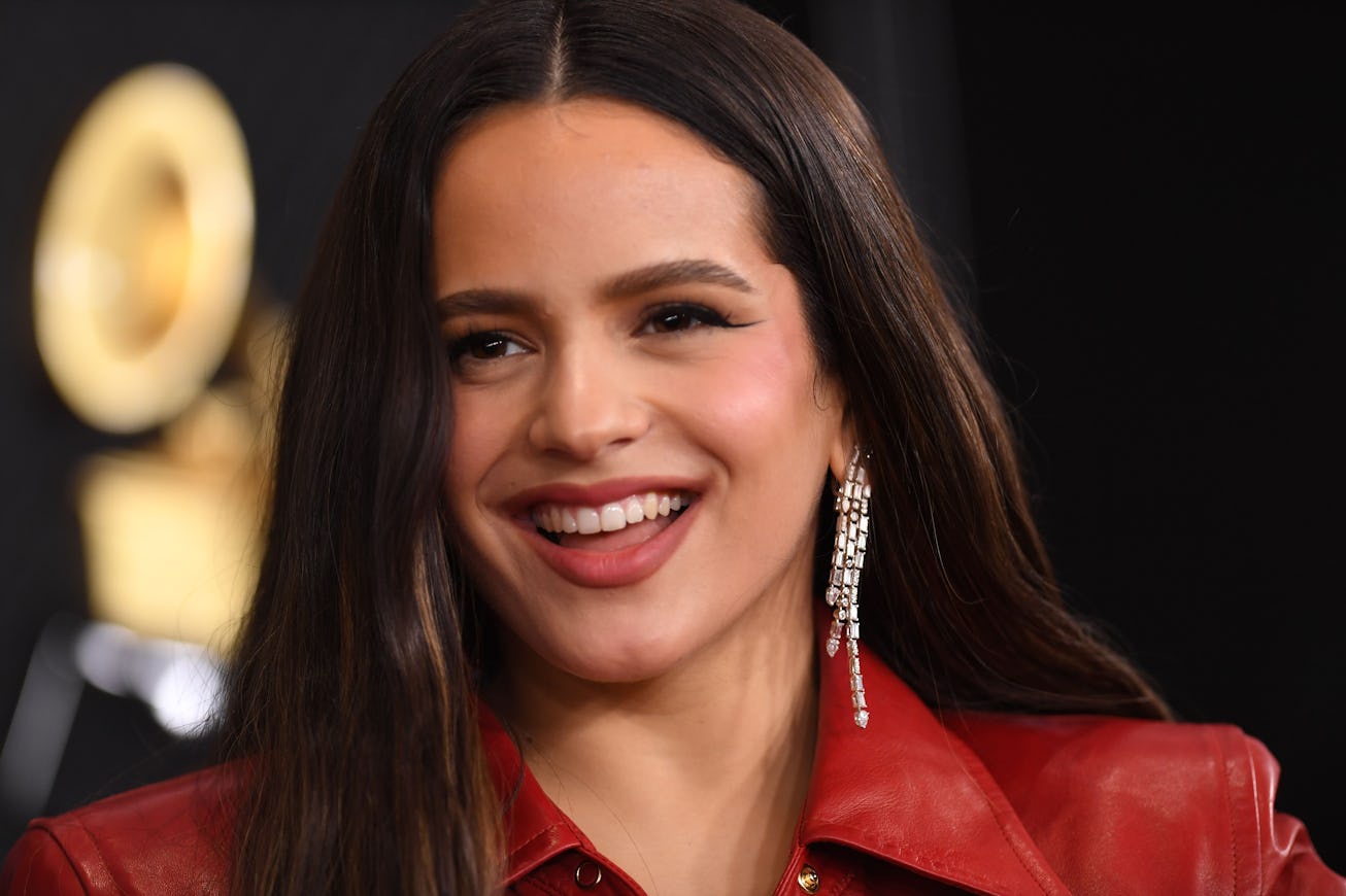 Rosalía smiling during a red carpet appearance