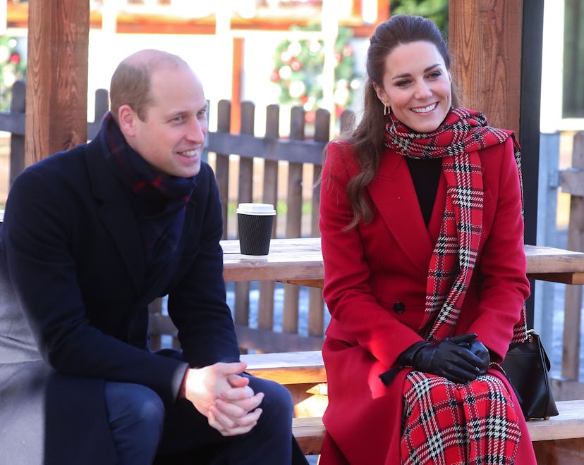 Kate Middleton and Prince William are smiling.