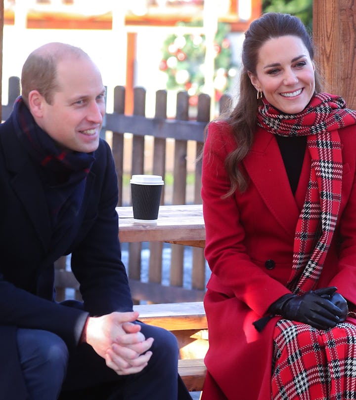 Kate Middleton and Prince William are smiling.