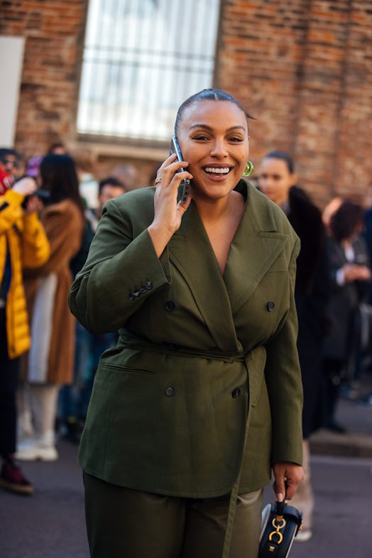 Paloma Elsesser poses in a green suit