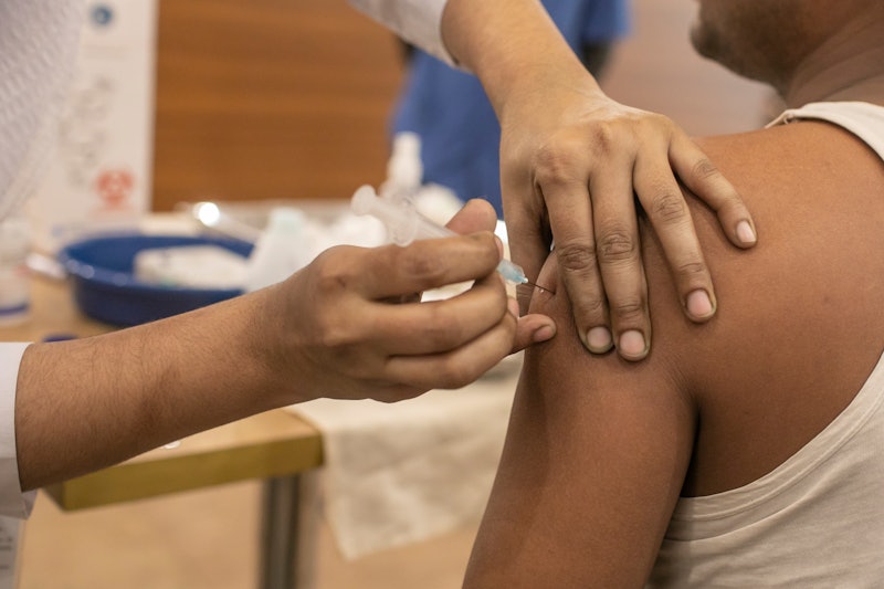 A person receives a vaccine shot in the arm. Since you need two doses of the COVID vaccine, you migh...