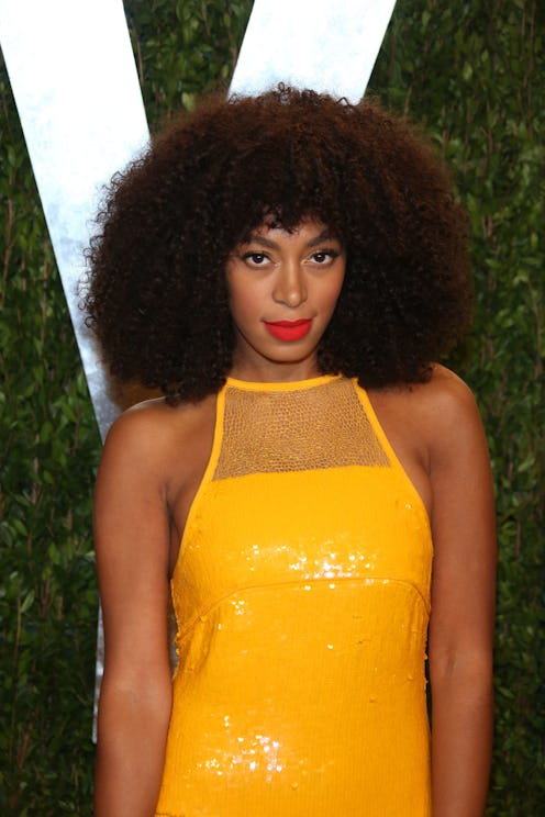 Solange Knowles wears her curly hair with bangs.