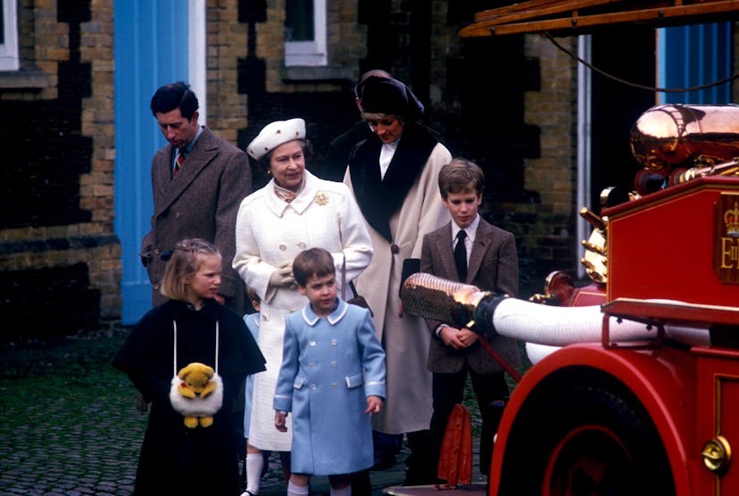 Queen Elizabeth inspects a fire engine with Princess Diana and grandchildren, 1988.