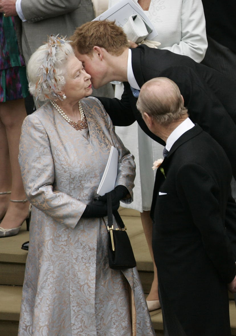 Prince Harry kisses his grandmother in 2008.