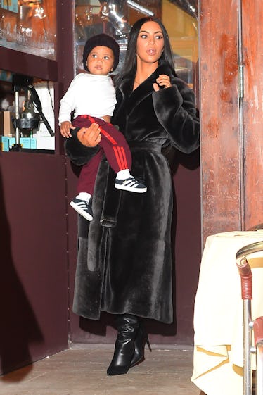 Kim Kardashian’s photos of Saint cutting his own hair are so cute.