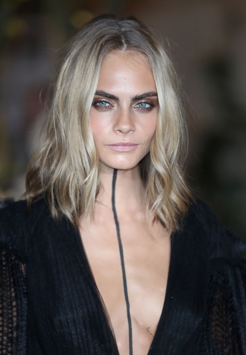 Cara Delevingne's ashy blonde is a 2021 spring hair trend.