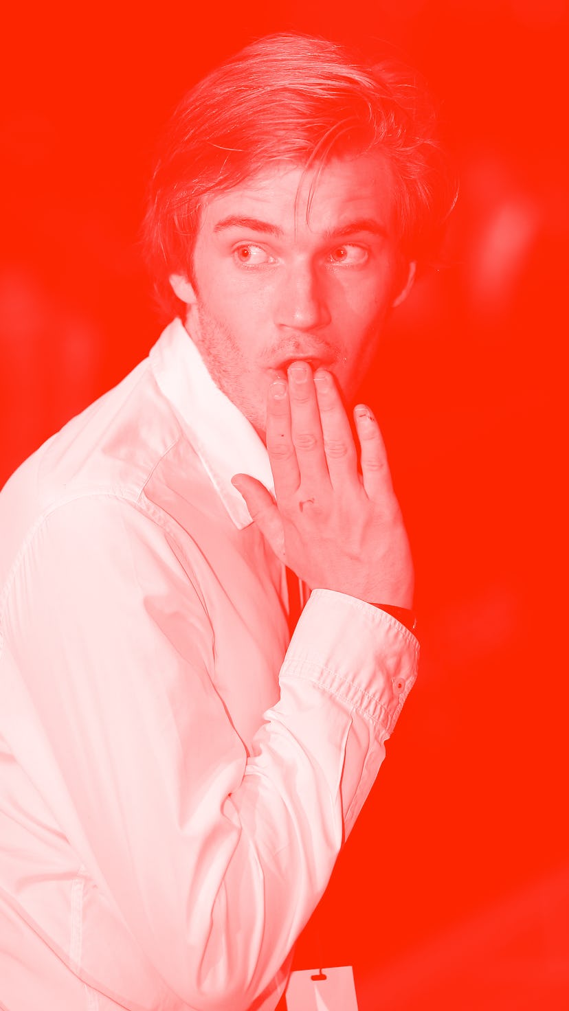 PewDiePie with his hand over his mouth pretending to be shocked.