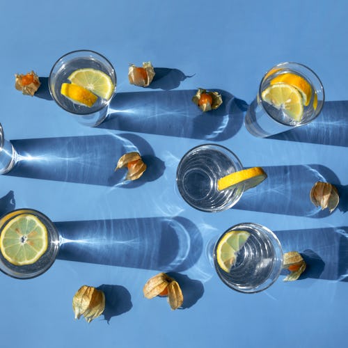 Glasses of seltzer with lemon on a blue background. Dry january delayed one woman's sobriety - here'...