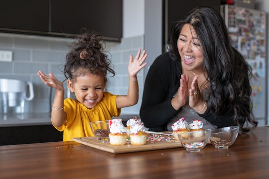 little girl baking cupcakes