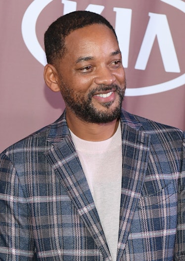Will Smith smiles on the red carpet.