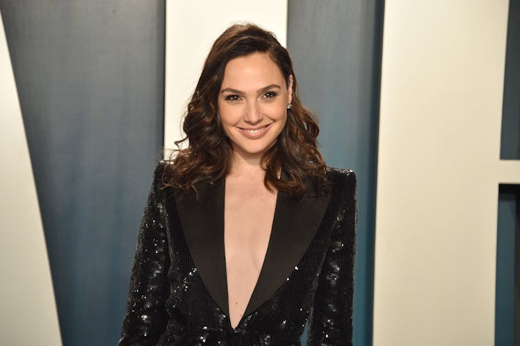 Gal Gadot wears a sequined suit on the red carpet. 