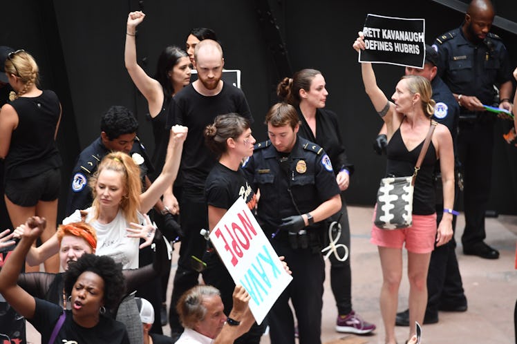 Demonstrators oppose Justice Brett Kavanaugh's Supreme Court nomination on Oct. 4, 2018.