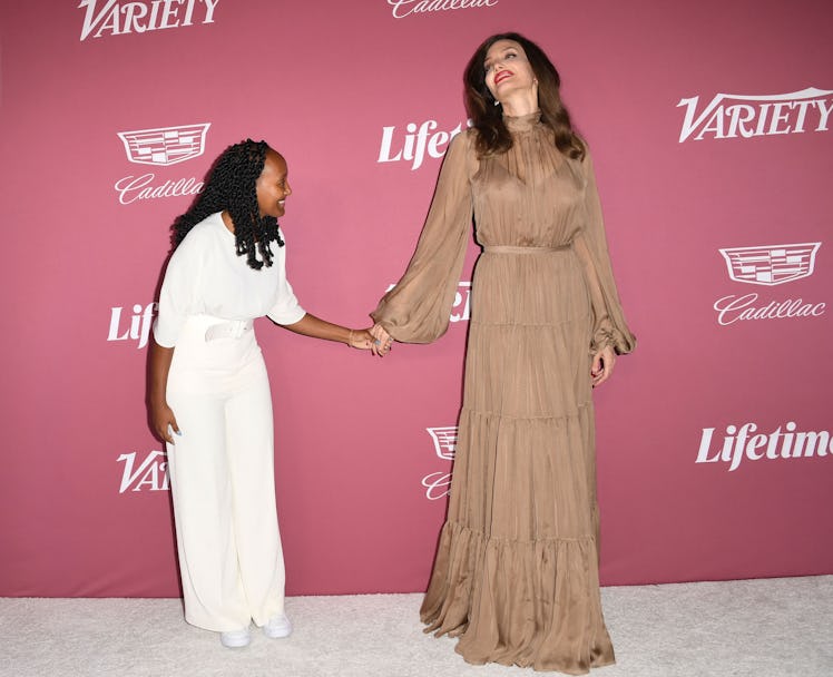 US actress Angelina Jolie and her daughter Zahara Jolie-Pitt (L) attend Varietys 2021 Power of Women...