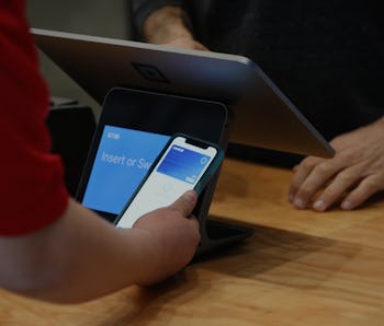 A customer uses pays for their order using Apple Pay at a Square Register at Mateo's on Thursday, Oc...