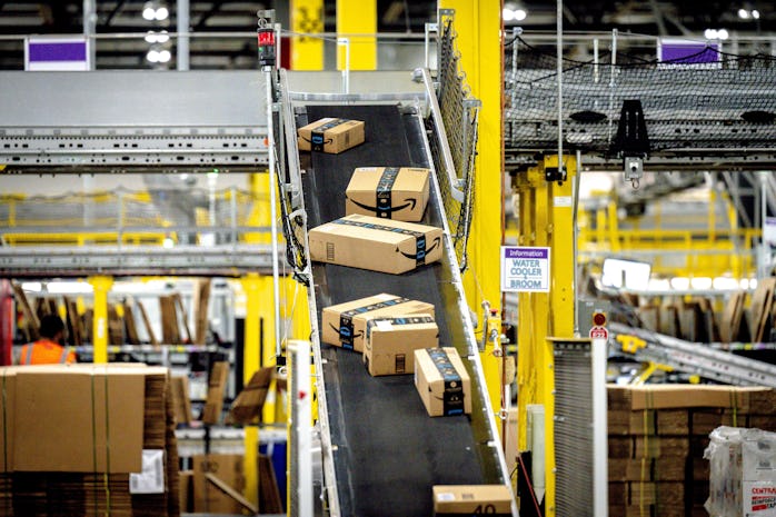 EASTVALE, CA - AUGUST 31: Packages move along a conveyor at Amazon fulfillment center in Eastvale on...