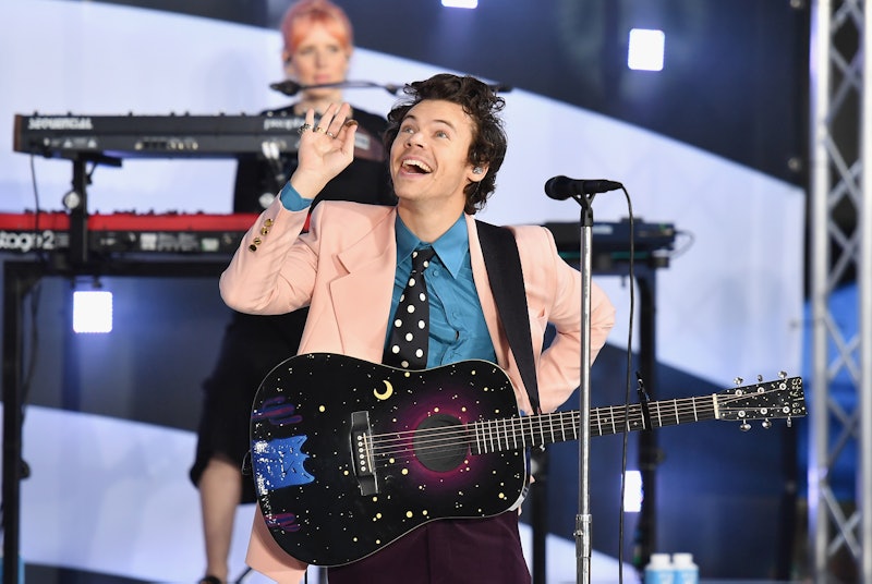 Harry Styles helped a fan reveal the sex of their baby to come onstage in Nashville. Photo via ANGEL...