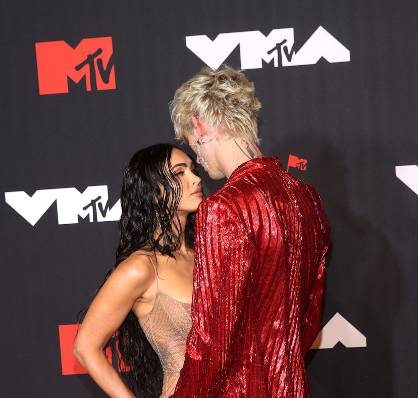 Megan Fox and Machine Gun Kelly on the red carpet. Their first kiss sounds weirdly hot.