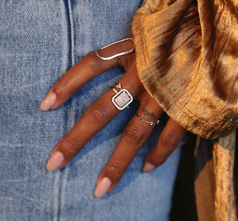 The best nude nail colors for dark skin include warm peachy and beige tones.