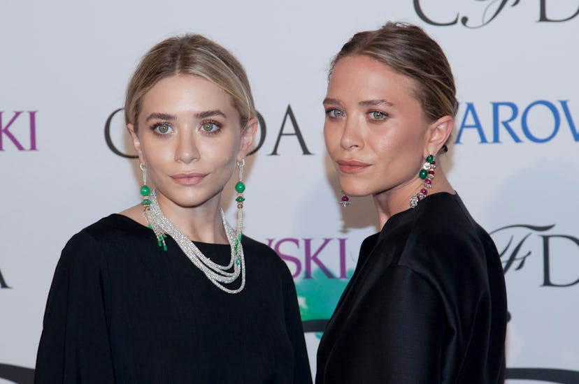 Ashley Olsen and Mary-Kate Olsen attend the "2014 CFDA Fashion Awards" red carpet arrivals at Alice ...