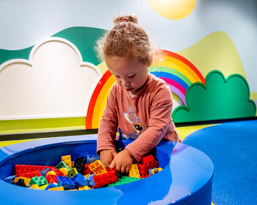 THE HAGUE, NETHERLANDS - JUNE 23: A child is seen playing with Lego during the opening of Legoland t...