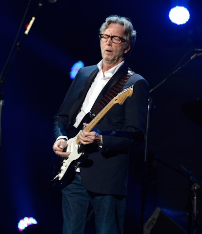 NEW YORK, NY - DECEMBER 12:  Eric Clapton performs at "12-12-12" a concert benefiting The Robin Hood...
