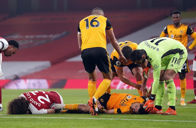 Arsenal's Brazilian defender David Luiz (L) and Wolverhampton Wanderers' Mexican striker Raul Jimene...