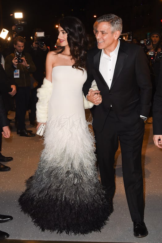 Amal Clooney wears feathered Versace gown while attending the Cesar Dinner with George Clooney on Fe...