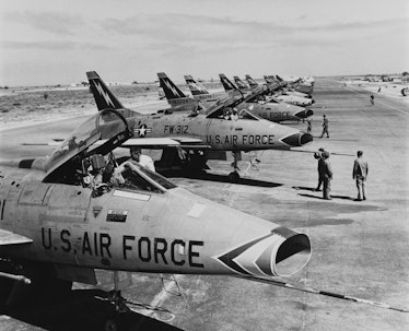 F-100 Super Sabre jet fighters of the US 49th Tactical Fighter Wing in a flight line at Wheelus Air ...