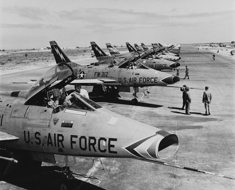 F-100 Super Sabre jet fighters of the US 49th Tactical Fighter Wing in a flight line at Wheelus Air ...