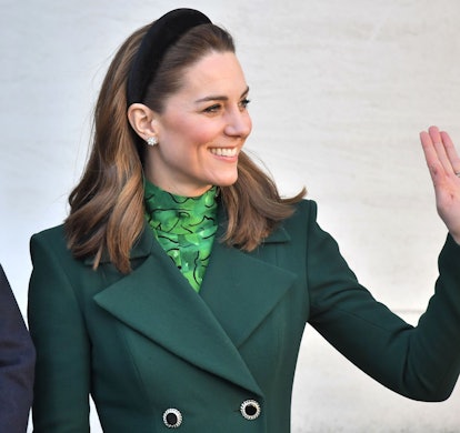 Kate Middleton wears emerald green coat, Allesandra Rich green printed dress, and a headband on Marc...
