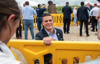 US Rep. Madison Cawthorn (R-NC) speaks to reporters during a visit to the border wall near Pharr, Te...